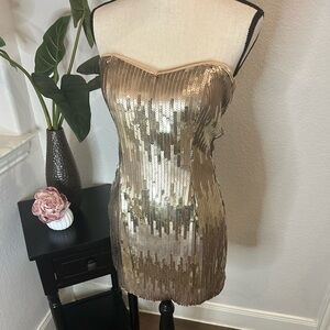 Gold and bronze sequined, size 7 strapless mini dress by Trixxi.